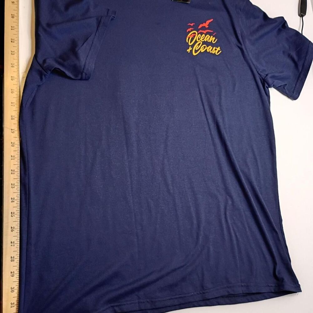 Ocean and Coast navy blue t-shirt with yellow and red accents. Size XL NWT